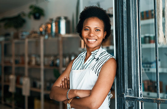 Woman in apron standing in store