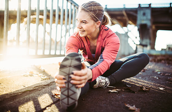 Credit union employee warming up for a run