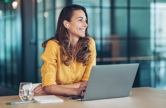 Woman sitting in front of a computer. 