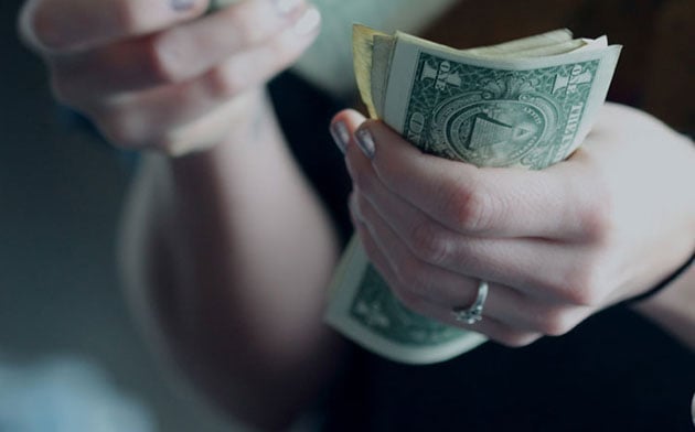 Person counting money