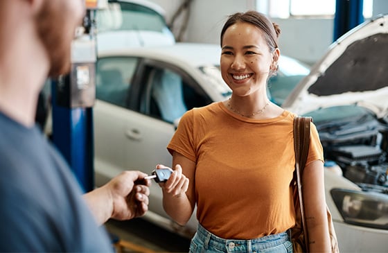 Woman purchasing a new car