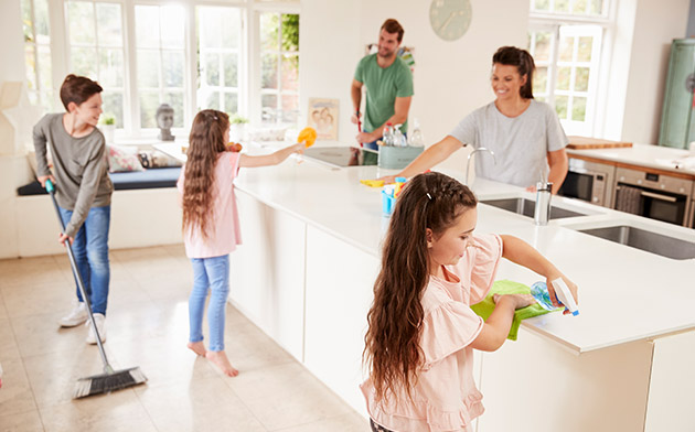 Family cleaning kitchen