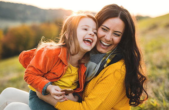 Mother and daughter playing outside