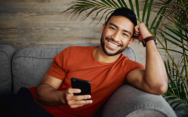 Young man holding phone