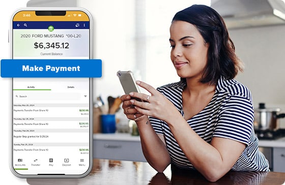 Person making a loan payment using credit union app