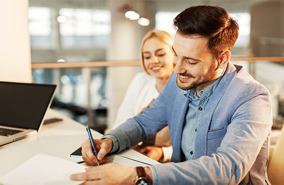 Man and woman sitting down thinking about refinancing their home with SELCO. 