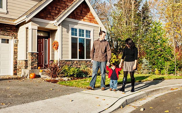 Couple walking with their toddler. 