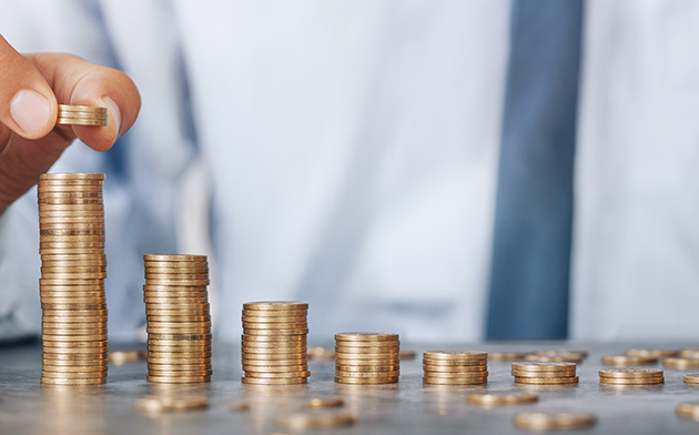 Man stacking coins.