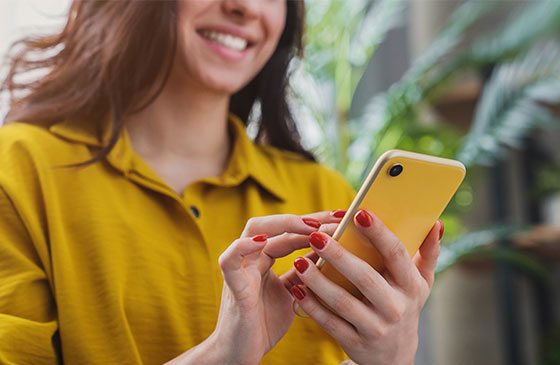 Women using phone to access mobile banking app