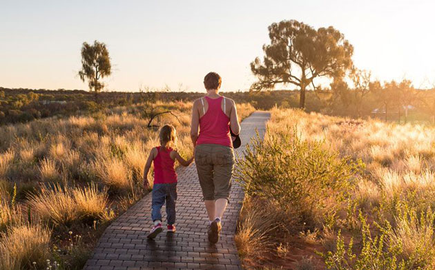 Woman walking with small girl