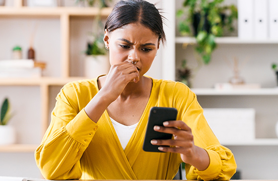 Concerned woman looking at phone