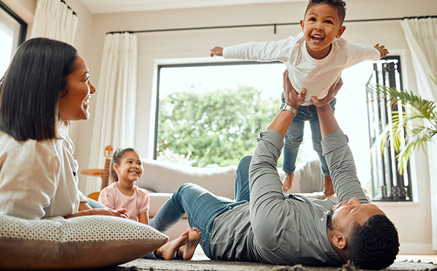 Couple playing with their son