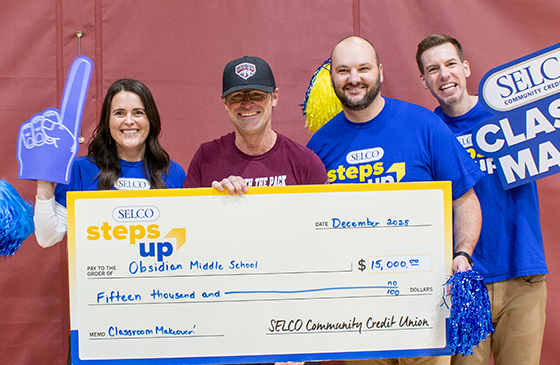 SELCO staff awarding Obsidian middle school staff the grant for their classroom makeover