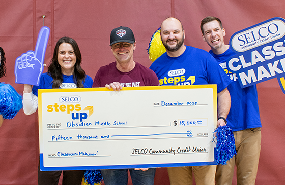 SELCO staff awarding Obsidian middle school staff the grant for their classroom makeover