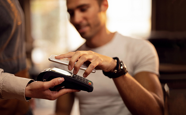 Man paying with mobile payment app